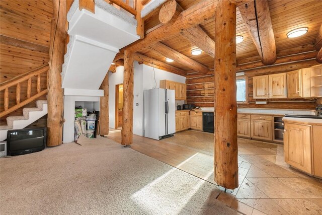 57785 Saturn Ct, Clark, CO 80428 - unfurnished living room with a wood stove, log walls, light colored carpet, and high vaulted ceiling