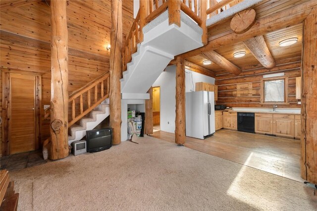 57785 Saturn Ct, Clark, CO 80428 - kitchen featuring freestanding refrigerator, dishwasher, log walls, wood ceiling, and light brown cabinetry