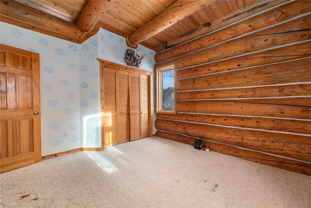 57785 Saturn Ct, Clark, CO 80428 - unfurnished bedroom featuring wallpapered walls, a wood ceiling with exposed beams, log walls, carpet, and a closet