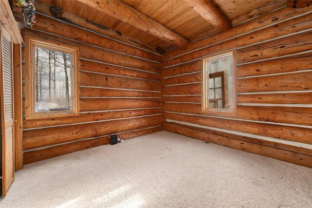 57785 Saturn Ct, Clark, CO 80428 - carpeted empty room featuring a wooden ceiling with exposed beams and rustic walls