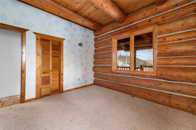57785 Saturn Ct, Clark, CO 80428 - unfurnished bedroom featuring a baseboard radiator, a wood ceiling with exposed beams, light colored carpet, wallpapered walls, and a closet