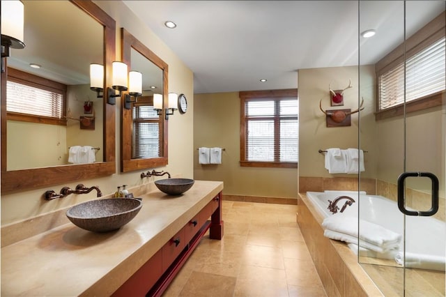 full bathroom with a garden tub, a sink, an enclosed shower, and tile patterned floors