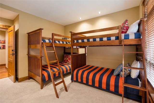 carpeted bedroom featuring recessed lighting
