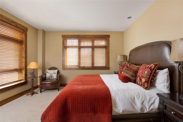 bedroom with baseboards and carpet flooring