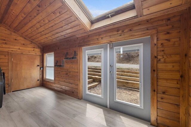 30311 County Road 16 Unit 105, Oak Creek, CO 80467 - doorway featuring wooden walls, french doors, wood ceiling, and vaulted ceiling with skylight