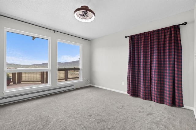 30311 County Road 16 Unit 105, Oak Creek, CO 80467 - carpeted empty room featuring a baseboard radiator and baseboards
