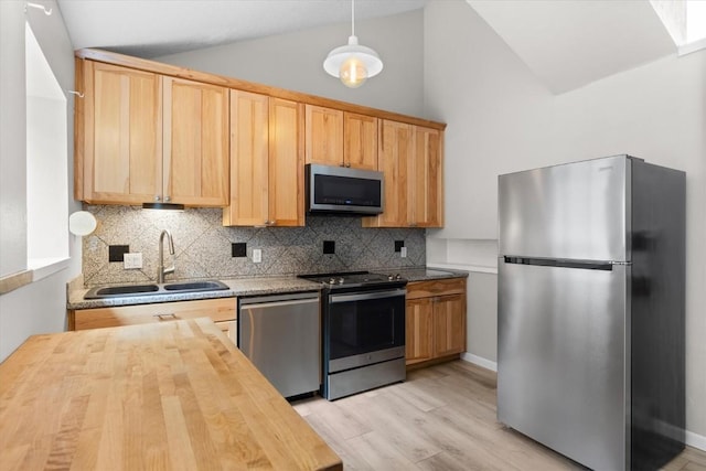 30311 County Road 16 Unit 105, Oak Creek, CO 80467 - kitchen featuring butcher block countertops, a sink, light brown cabinets, stainless steel appliances, and light wood-style flooring