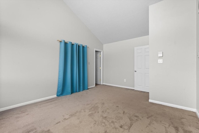 30311 County Road 16 Unit 105, Oak Creek, CO 80467 - spare room featuring baseboards, carpet, and high vaulted ceiling