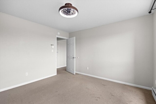 30311 County Road 16 Unit 105, Oak Creek, CO 80467 - empty room with carpet and baseboard heating