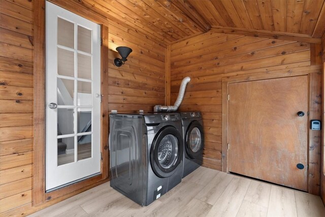 30311 County Road 16 Unit 105, Oak Creek, CO 80467 - washroom with separate washer and dryer, wooden ceiling, wood walls, and light wood-style flooring
