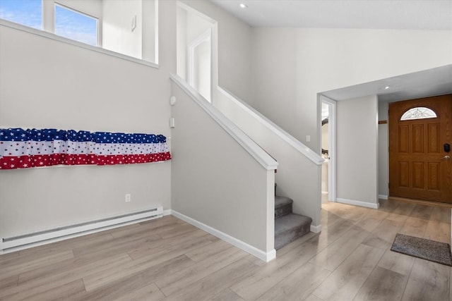 30311 County Road 16 Unit 105, Oak Creek, CO 80467 - entrance foyer featuring baseboard heating, stairs, recessed lighting, baseboards, and wood finished floors