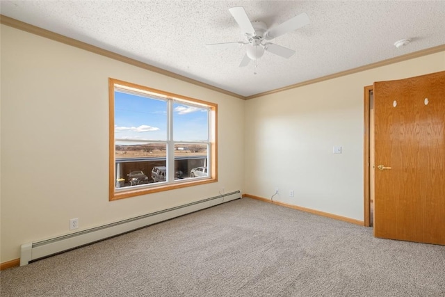 407 S 3rd St Unit 407, Hayden, CO 81639 - carpeted empty room with a baseboard radiator, ornamental molding, a smoke detector, a ceiling fan, and a textured ceiling