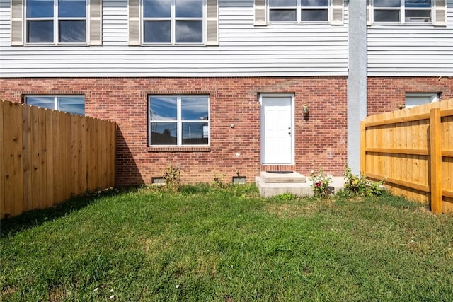 407 S 3rd St Unit 407, Hayden, CO 81639 - back of house with a fenced backyard and brick siding