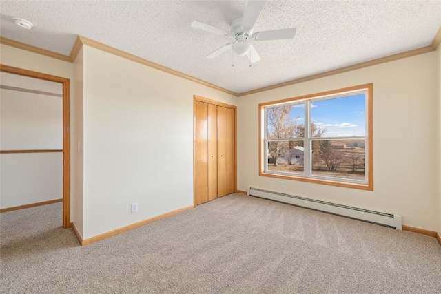 407 S 3rd St Unit 407, Hayden, CO 81639 - unfurnished room featuring baseboard heating, light carpet, crown molding, a textured ceiling, and ceiling fan