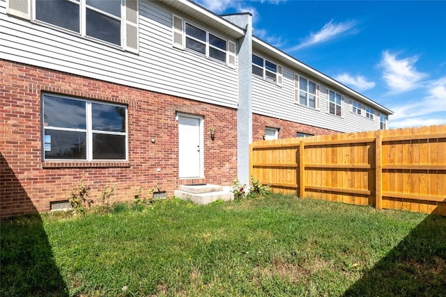 407 S 3rd St Unit 407, Hayden, CO 81639 - rear view of property featuring brick siding and crawl space