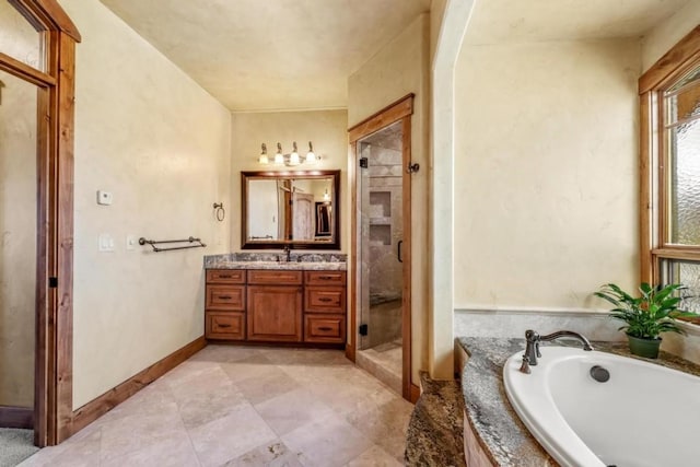 1138 Longview Cir, Steamboat Springs, CO 80487 - bathroom featuring vanity, a stall shower, and a bath