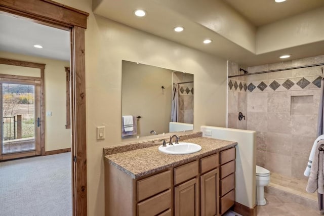 1138 Longview Cir, Steamboat Springs, CO 80487 - bathroom featuring recessed lighting, a tile shower, toilet, vanity, and tile patterned flooring