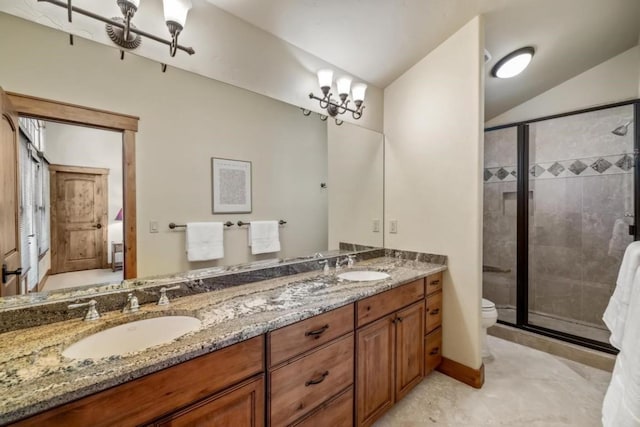 1138 Longview Cir, Steamboat Springs, CO 80487 - full bathroom featuring a stall shower, double vanity, toilet, and lofted ceiling