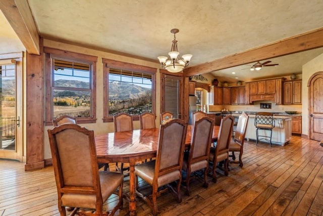 1138 Longview Cir, Steamboat Springs, CO 80487 - dining space featuring hardwood / wood-style flooring, a chandelier, beam ceiling, and baseboards