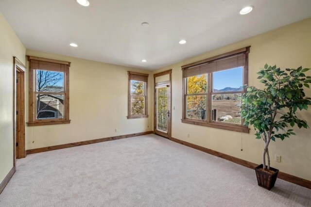 1138 Longview Cir, Steamboat Springs, CO 80487 - empty room featuring light colored carpet, healthy amount of natural light, baseboards, and recessed lighting