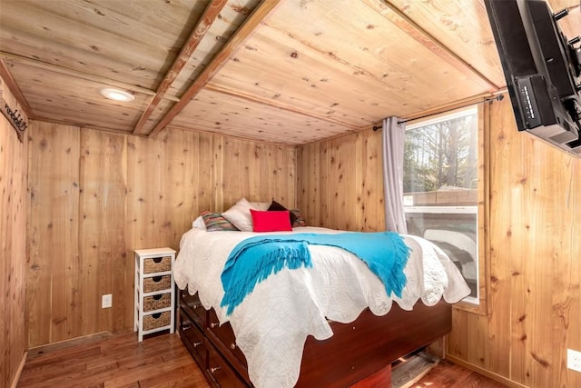 bedroom featuring wood ceiling, wood finished floors, and wood walls