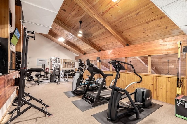 exercise room with wood walls, wooden ceiling, carpet floors, and lofted ceiling
