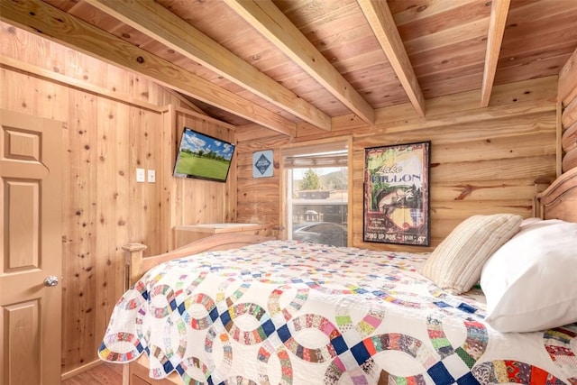 bedroom with wood ceiling, beam ceiling, wooden walls, and wood finished floors