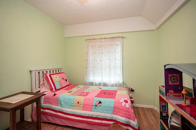 420 County Road 64, Craig, CO 81625 - bedroom featuring a textured ceiling, baseboards, wood finished floors, and lofted ceiling