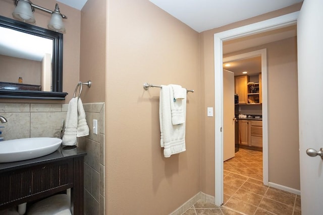 420 County Road 64, Craig, CO 81625 - bathroom with vanity, tasteful backsplash, baseboards, and tile patterned flooring