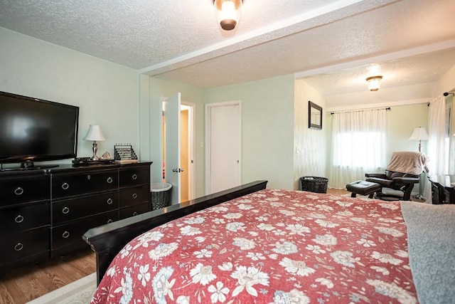 420 County Road 64, Craig, CO 81625 - bedroom with a textured ceiling and wood finished floors