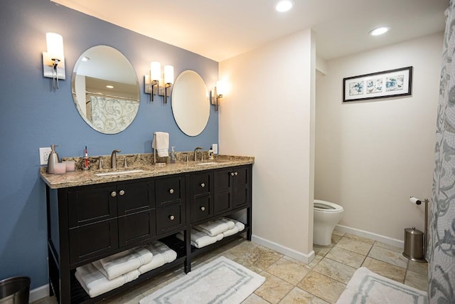 420 County Road 64, Craig, CO 81625 - full bath featuring baseboards, toilet, a sink, and double vanity