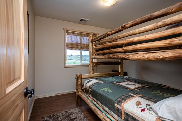 420 County Road 64, Craig, CO 81625 - bedroom with visible vents, dark wood-style flooring, and baseboards
