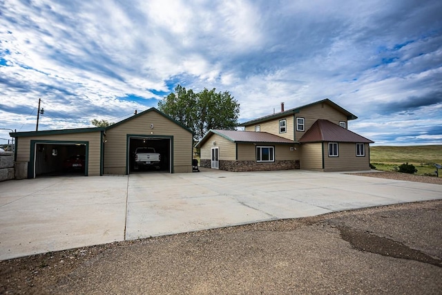 420 County Road 64, Craig, CO 81625 - view of front facade with concrete driveway and an outbuilding
