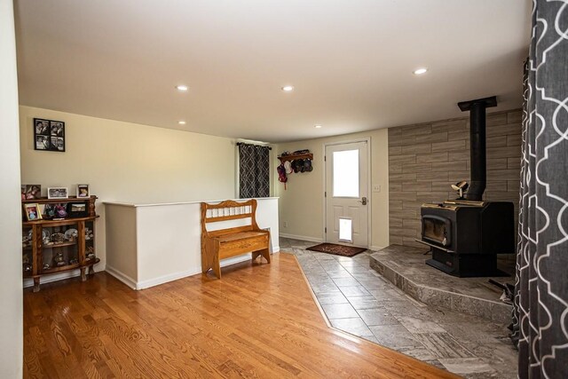 420 County Road 64, Craig, CO 81625 - living area with a wood stove, wood finished floors, baseboards, and recessed lighting