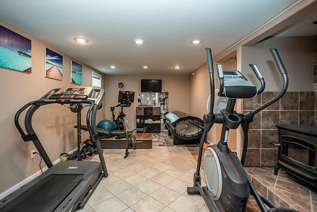 420 County Road 64, Craig, CO 81625 - workout area featuring a wood stove, light tile patterned floors, and recessed lighting