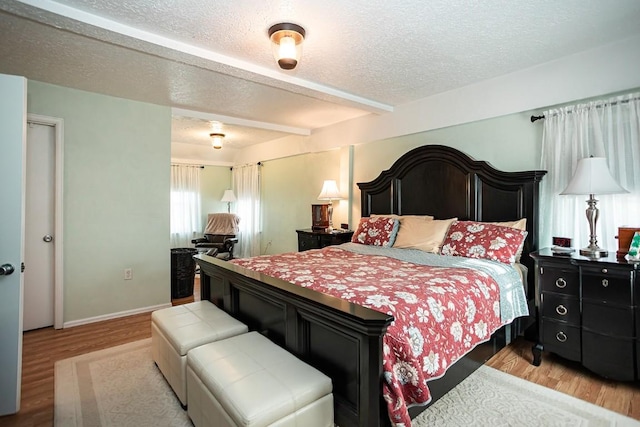 420 County Road 64, Craig, CO 81625 - bedroom with a textured ceiling, light wood-style flooring, and baseboards