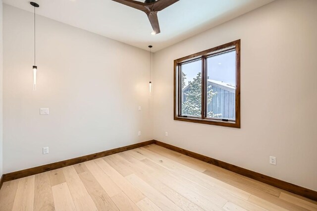 empty room with hardwood / wood-style flooring