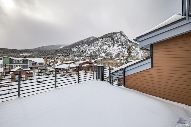 snowy yard with a mountain view