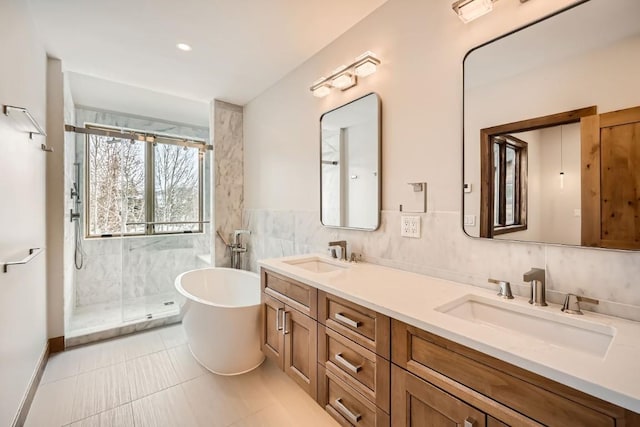 bathroom featuring shower with separate bathtub, tasteful backsplash, tile walls, tile patterned flooring, and vanity