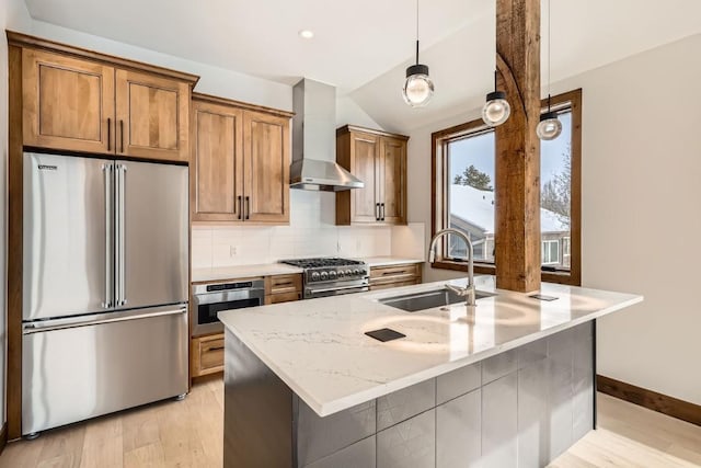 kitchen featuring vaulted ceiling, premium appliances, decorative backsplash, light stone countertops, and wall chimney exhaust hood