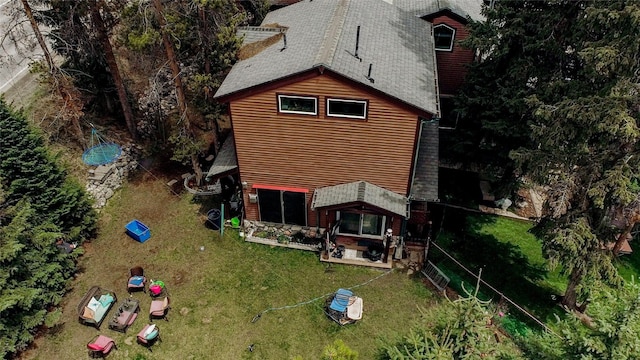 14 Rock Springs Rd, Breckenridge, CO 80424 - rear view of house featuring roof with shingles, a lawn, and a patio