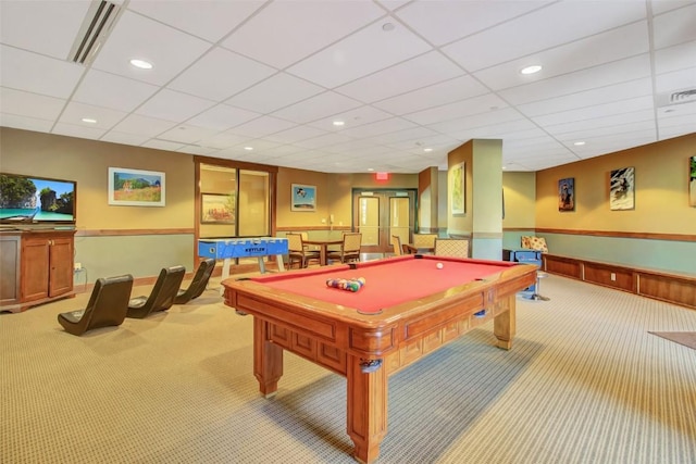 game room with pool table, a wainscoted wall, light colored carpet, visible vents, and a paneled ceiling