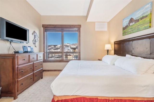 bedroom with visible vents, baseboards, and light colored carpet