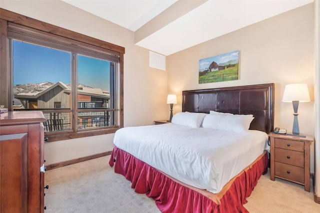 bedroom with carpet floors, visible vents, and baseboards