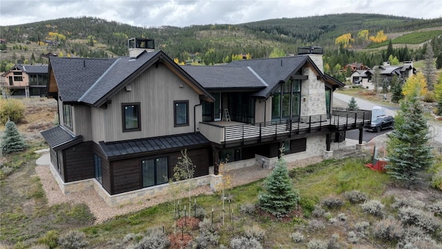 rear view of property with a mountain view