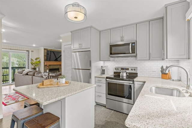 67 Peaks View Ct Unit 232, Blue River, CO 80424 - kitchen with stainless steel appliances, gray cabinets, backsplash, recessed lighting, and crown molding