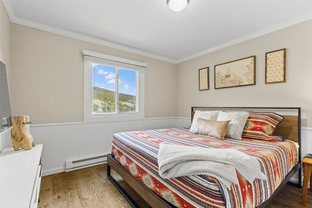 67 Peaks View Ct Unit 232, Blue River, CO 80424 - bedroom featuring baseboard heating, crown molding, and wood finished floors