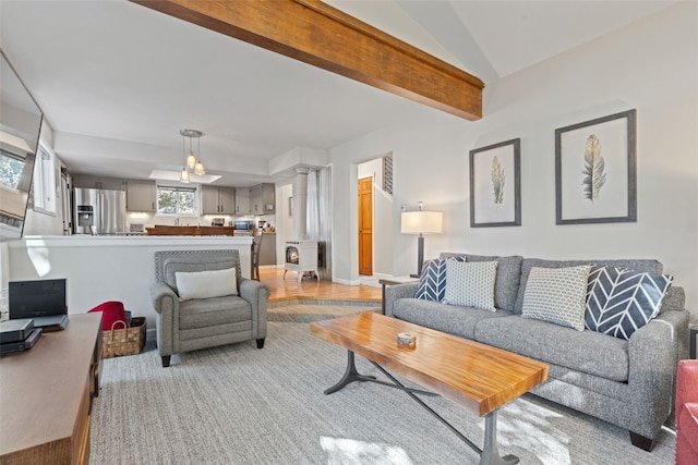211 S High St, Breckenridge, CO 80424 - living area featuring lofted ceiling, light wood finished floors, and decorative columns