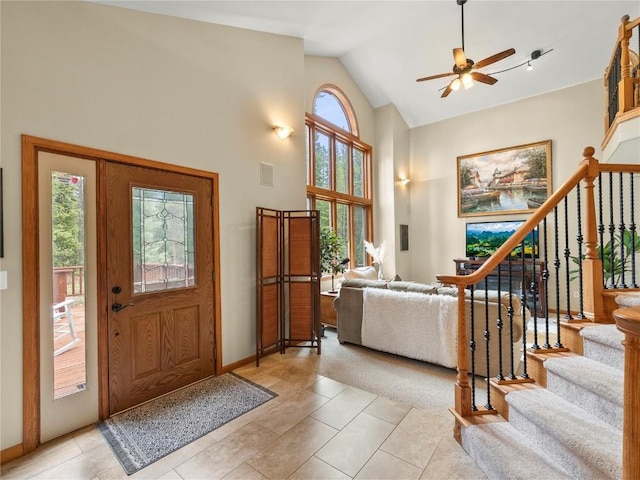 50 Sunset Dr, Breckenridge, CO 80424 - foyer entrance featuring a ceiling fan, stairway, light tile patterned flooring, and high vaulted ceiling
