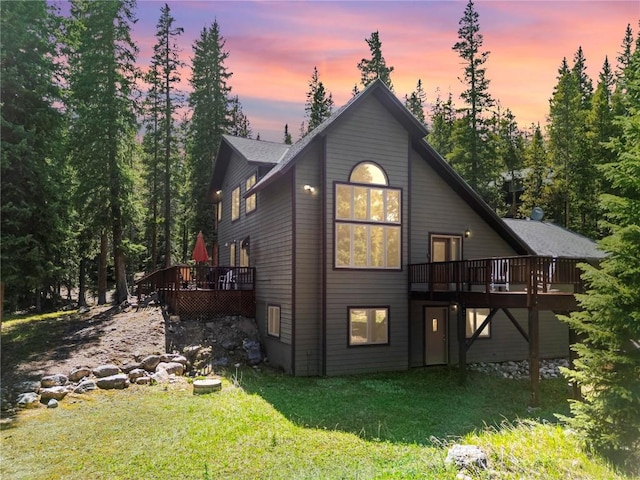 50 Sunset Dr, Breckenridge, CO 80424 - back of house at dusk with a deck and a yard